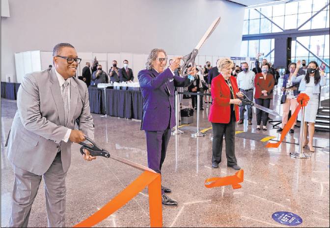 Councilman Cedric Crear, left, International Market Centers CEO Bob Maricich and Mayor Carolyn Goodman participate in a ribbon-cutting for the Expo at World Market Center on Friday in downtown Las Vegas.